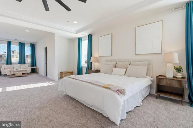 a spacious bedroom with a bed and a window