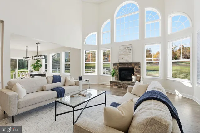 a living room with furniture fireplace and flat screen tv