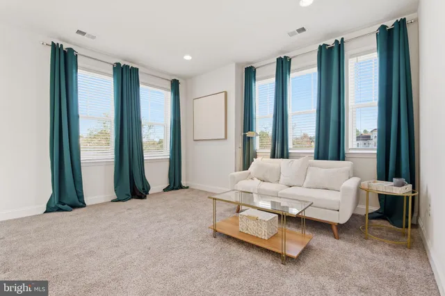 a view of a kitchen with a sink and a stove top oven