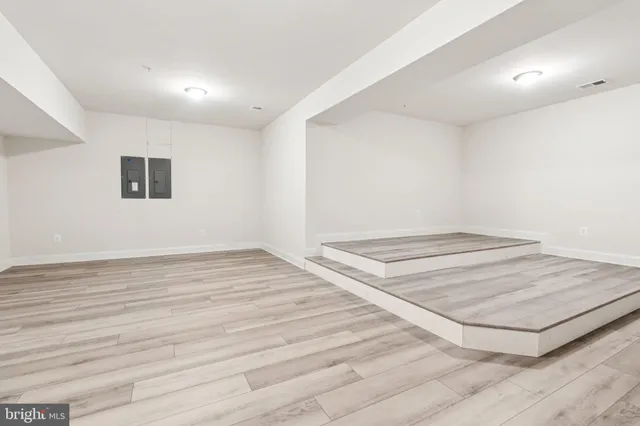 an aerial view of residential houses with outdoor space and swimming pool