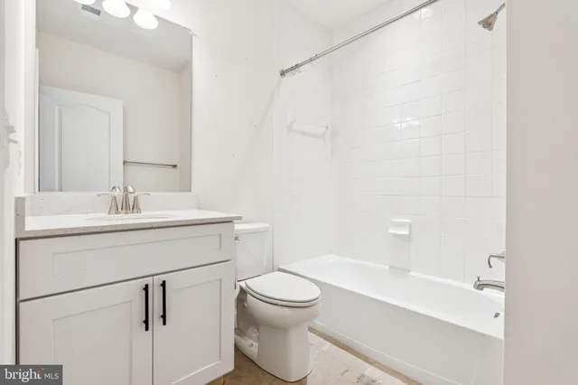 an aerial view of residential house with outdoor space and swimming pool