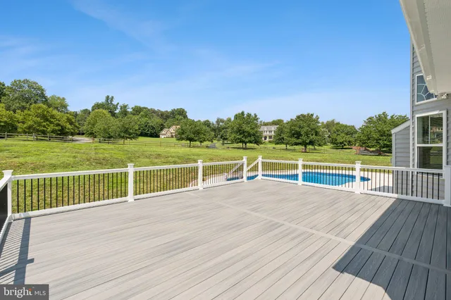 a picture of a bench in front of a wall