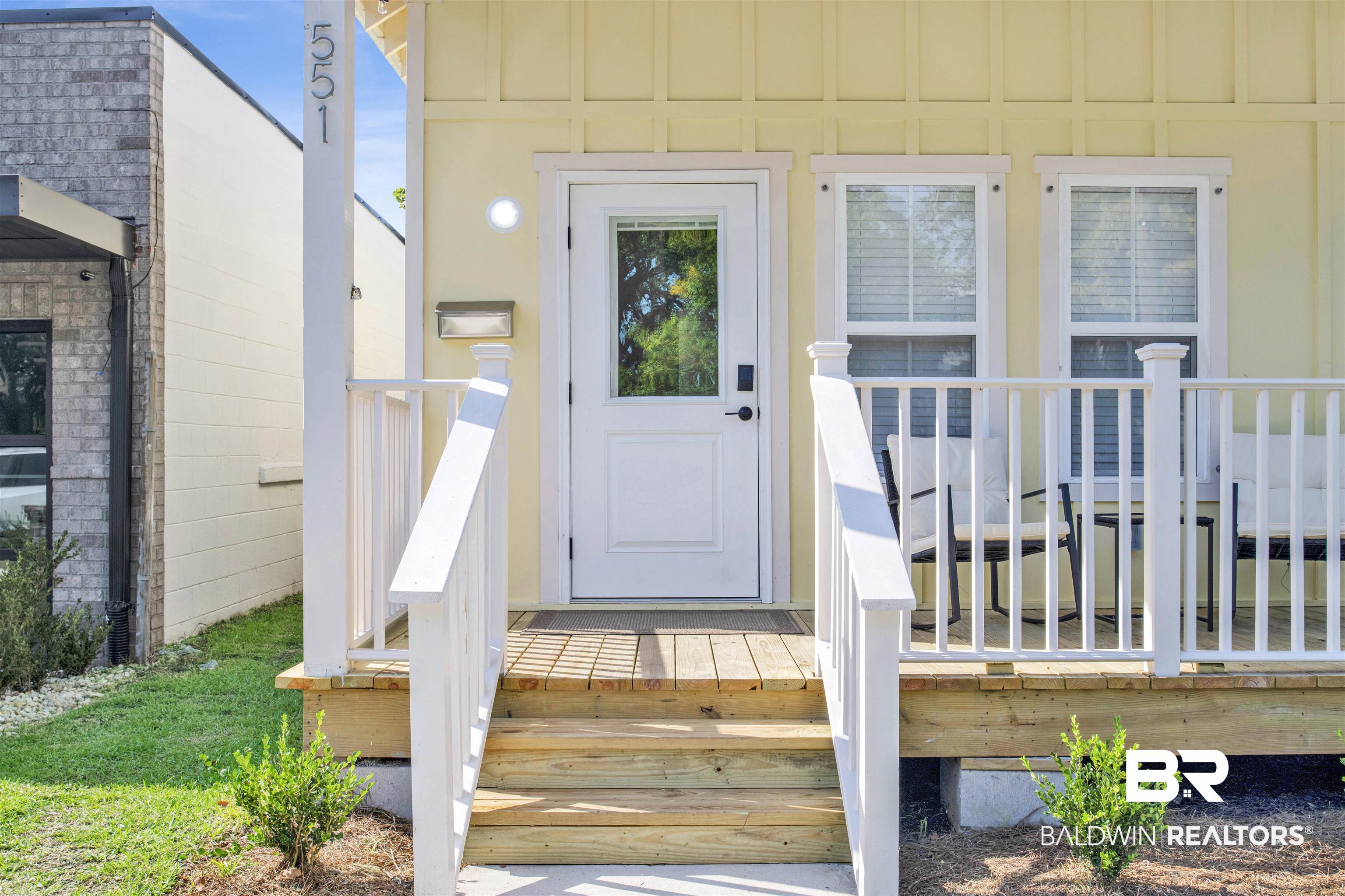 551 Congress Street Mobile, AL 36603 - Photo 5 of 19 Property entrance with board and batten siding
