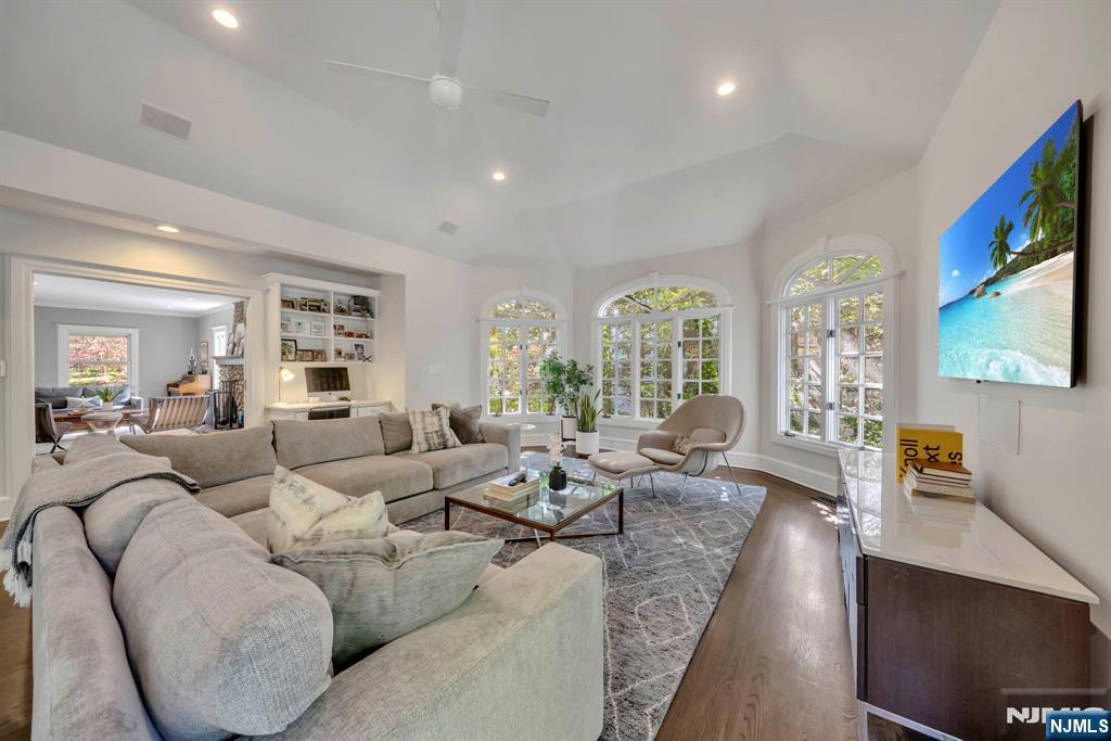 64 Park Slope Ridgewood, NJ 07450 - Photo 12 of 47 a living room with furniture wooden floor and a flat screen tv