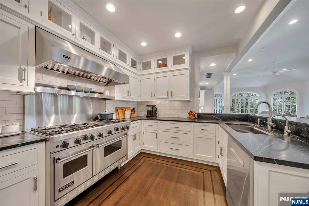 64 Park Slope Ridgewood, NJ 07450 - Photo 15 of 47 a kitchen with stainless steel appliances granite countertop a stove a sink and a microwave