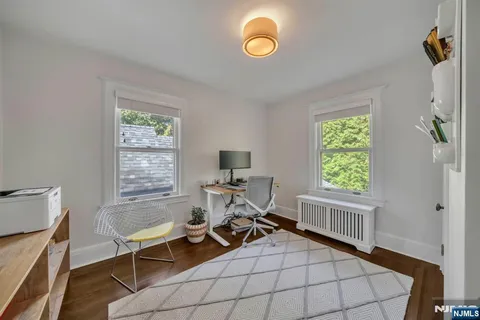 a work room with furniture and a window