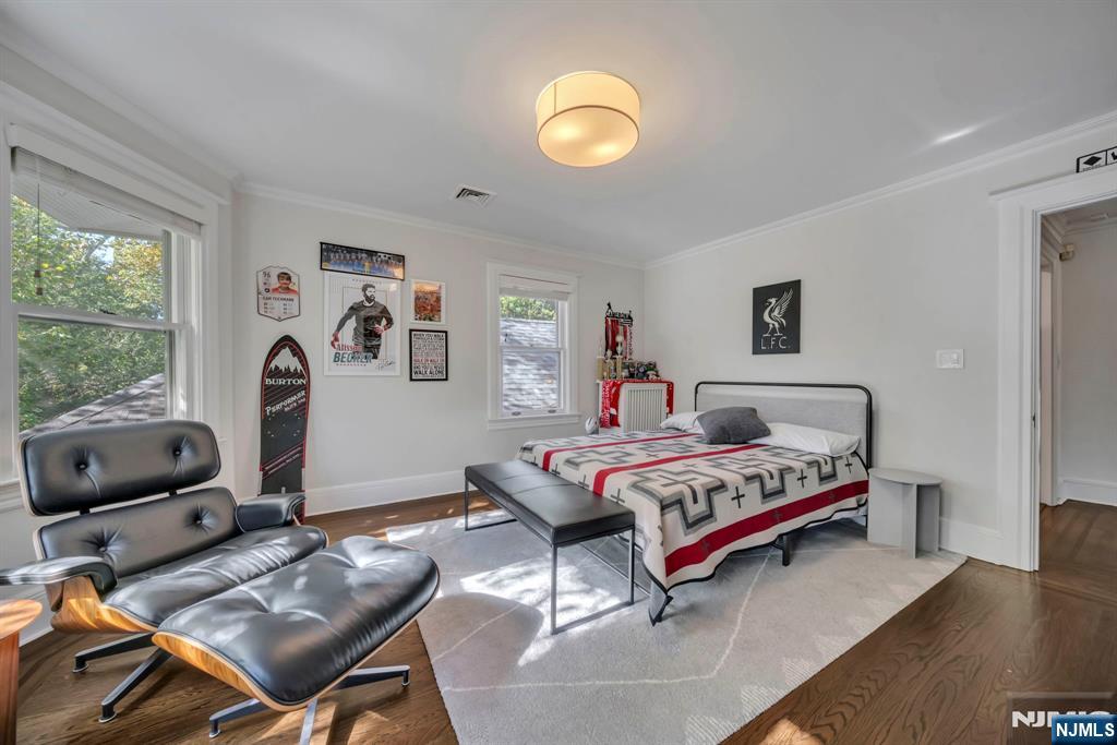 64 Park Slope Ridgewood, NJ 07450 - Photo 24 of 47 a bedroom with a bed and a window