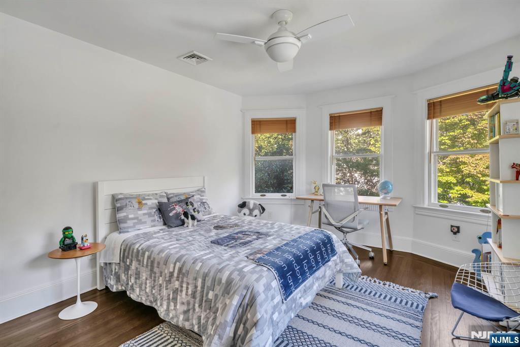 64 Park Slope Ridgewood, NJ 07450 - Photo 25 of 47 a bedroom with bed and a large window