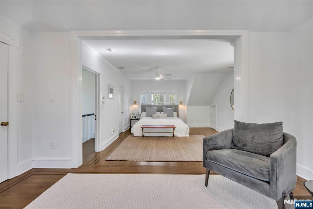 64 Park Slope Ridgewood, NJ 07450 - Photo 31 of 47 a living room with furniture and a chandelier