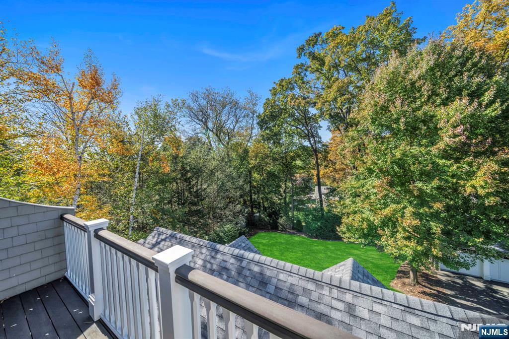 64 Park Slope Ridgewood, NJ 07450 - Photo 36 of 47 a view of a two chair and table in the balcony