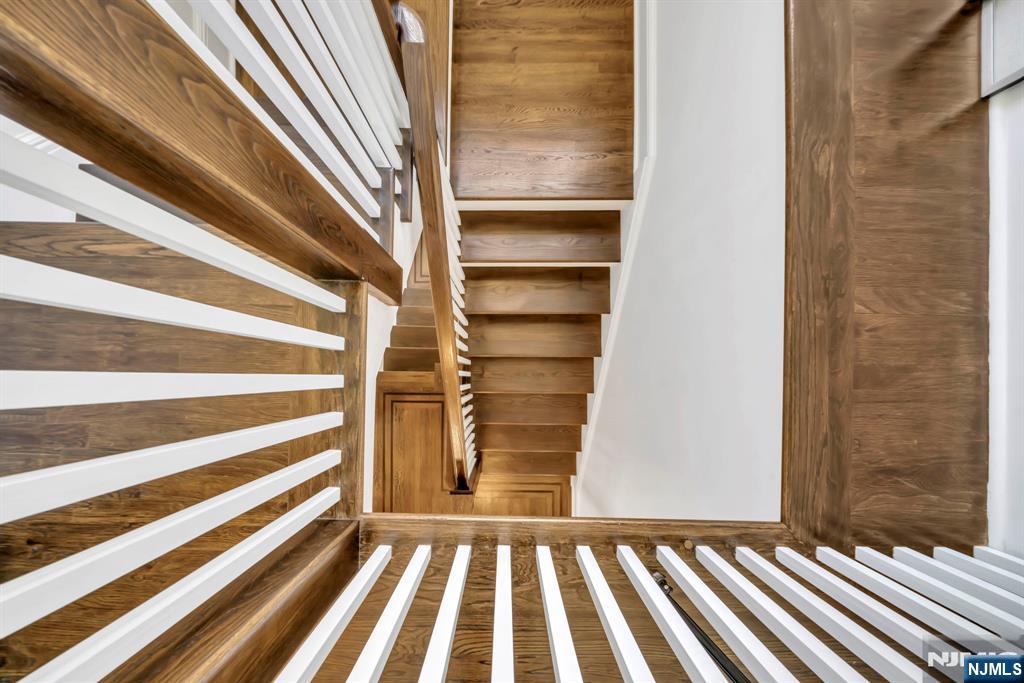 64 Park Slope Ridgewood, NJ 07450 - Photo 37 of 47 a view of a room with stairs and a rug