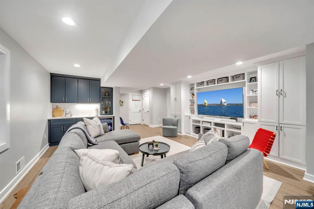 64 Park Slope Ridgewood, NJ 07450 - Photo 42 of 47 a living room with furniture and a flat screen tv