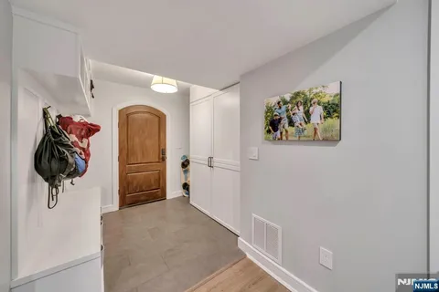 a view of a hallway with paintings on the wall
