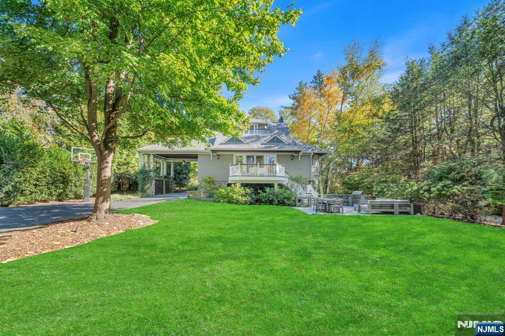 64 Park Slope Ridgewood, NJ 07450 - Photo 45 of 47 a front view of a house with a garden
