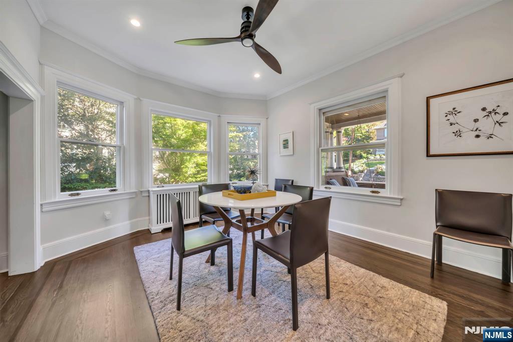 64 Park Slope Ridgewood, NJ 07450 - Photo 7 of 47 a dining room with furniture a rug and wooden floor