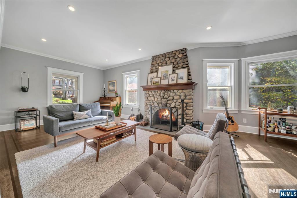64 Park Slope Ridgewood, NJ 07450 - Photo 10 of 47 a living room with furniture large window and a fireplace