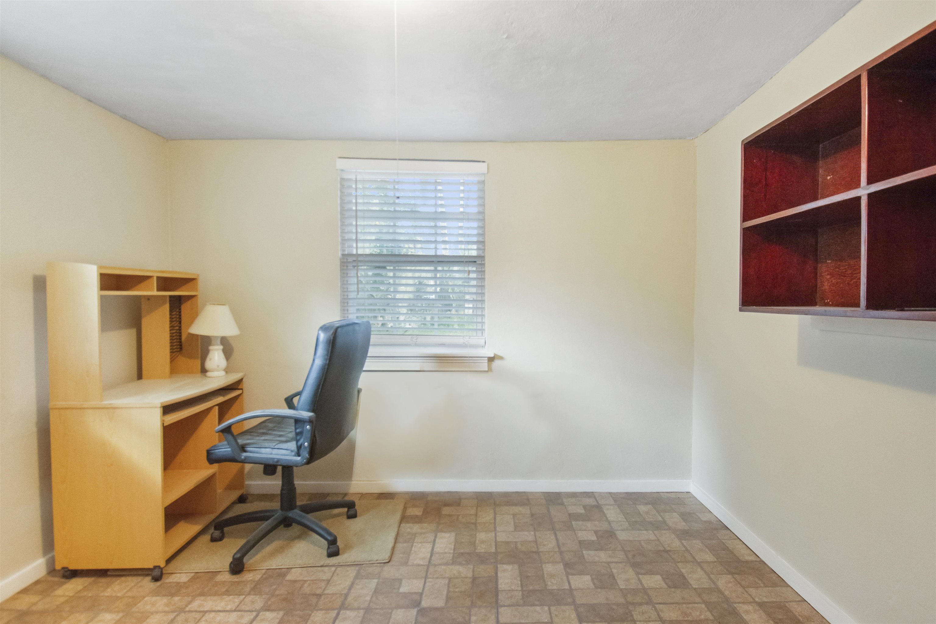 100 Spring Street St. Augustine, FL 32084 - Photo 17 of 21 a view of a workspace with furniture and a window