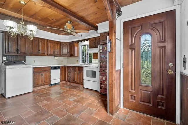 a view of a kitchen with a sink and cabinets