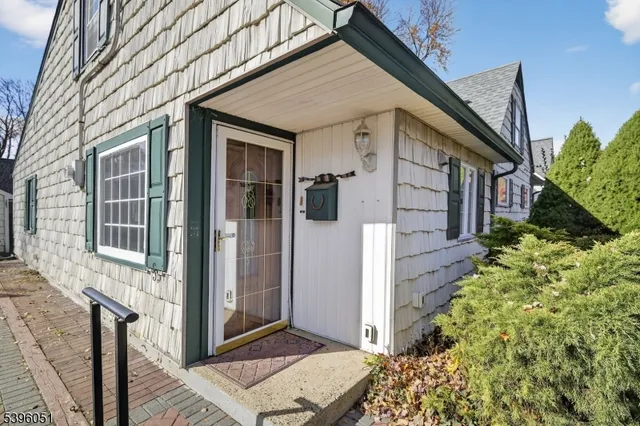 a view of a house with a door and wooden walls