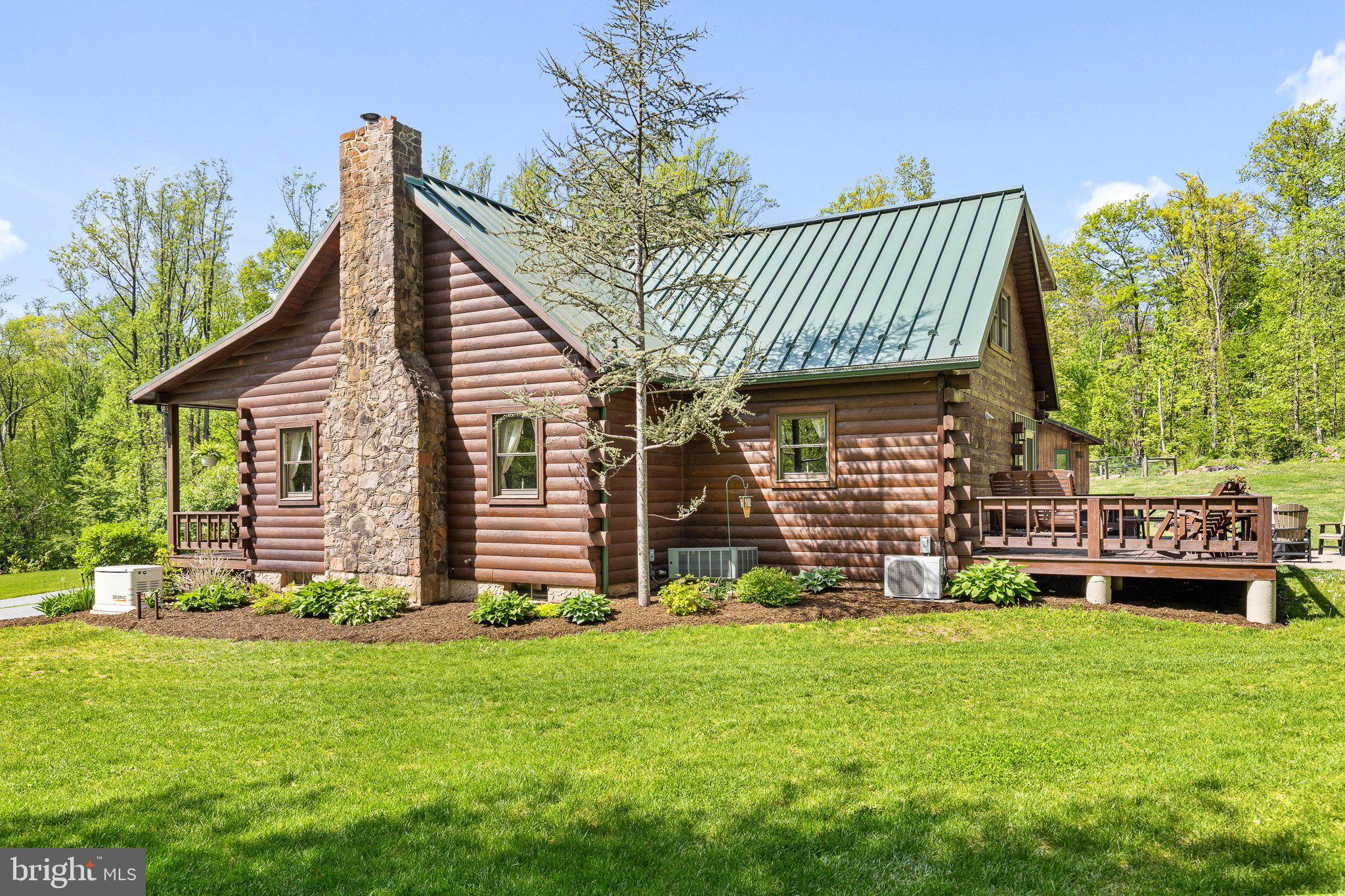 491 Sheep Hill Road Newmanstown, PA 17073 - Photo 4 of 30 a front view of a house with a garden