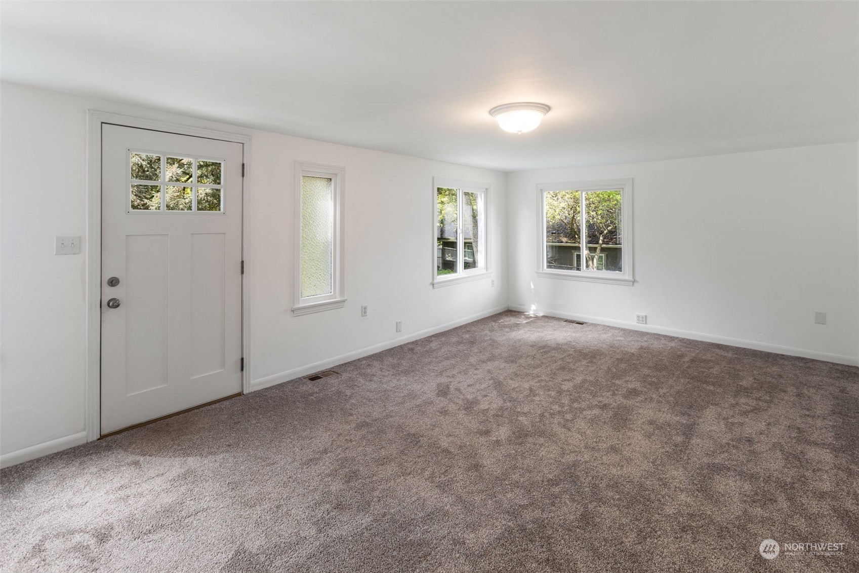 11616 6th Avenue Southwest Seattle, WA 98146 - Photo 11 of 37 an empty room with windows