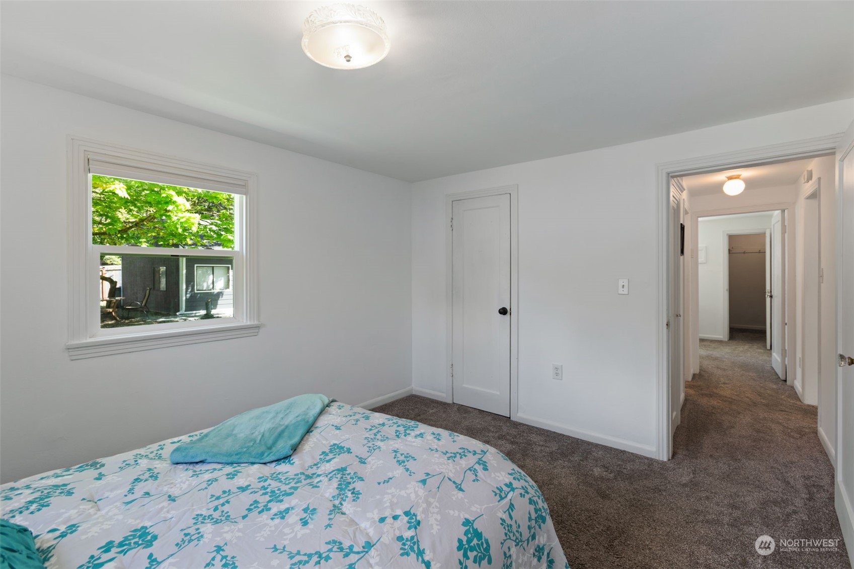 11616 6th Avenue Southwest Seattle, WA 98146 - Photo 13 of 37 a bedroom with a bed and a window
