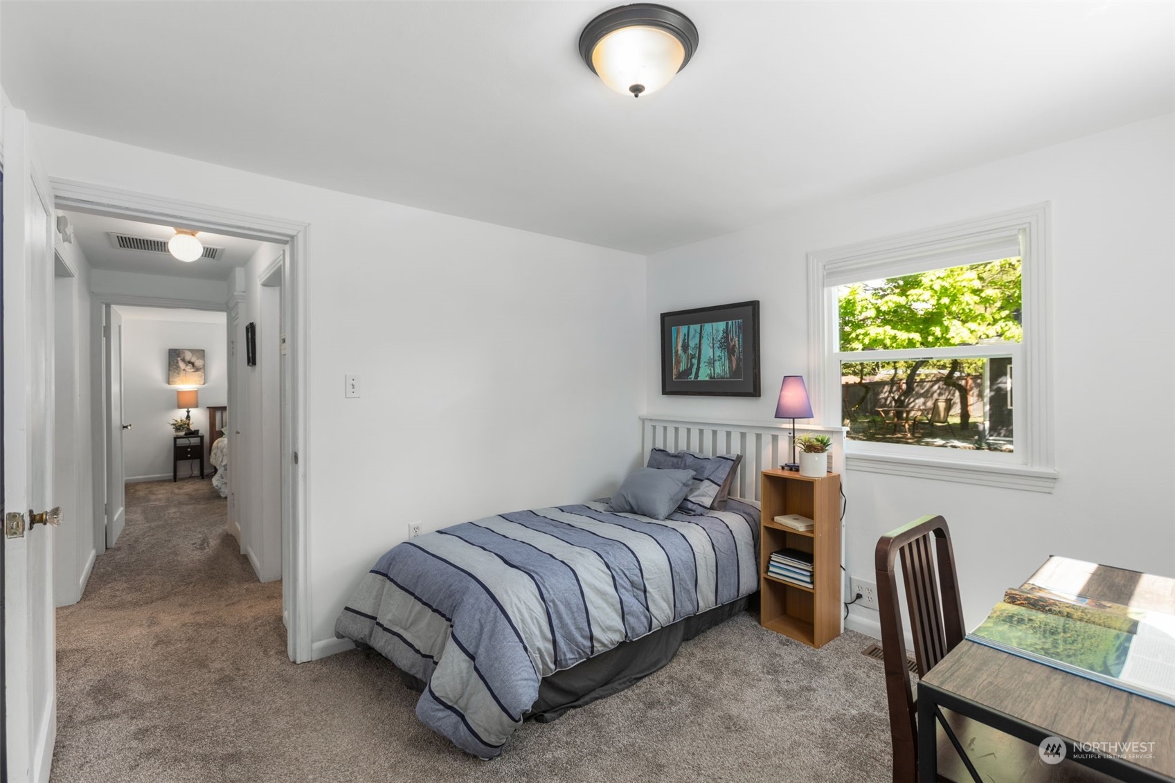 11616 6th Avenue Southwest Seattle, WA 98146 - Photo 14 of 37 a bedroom with a bed and a chair