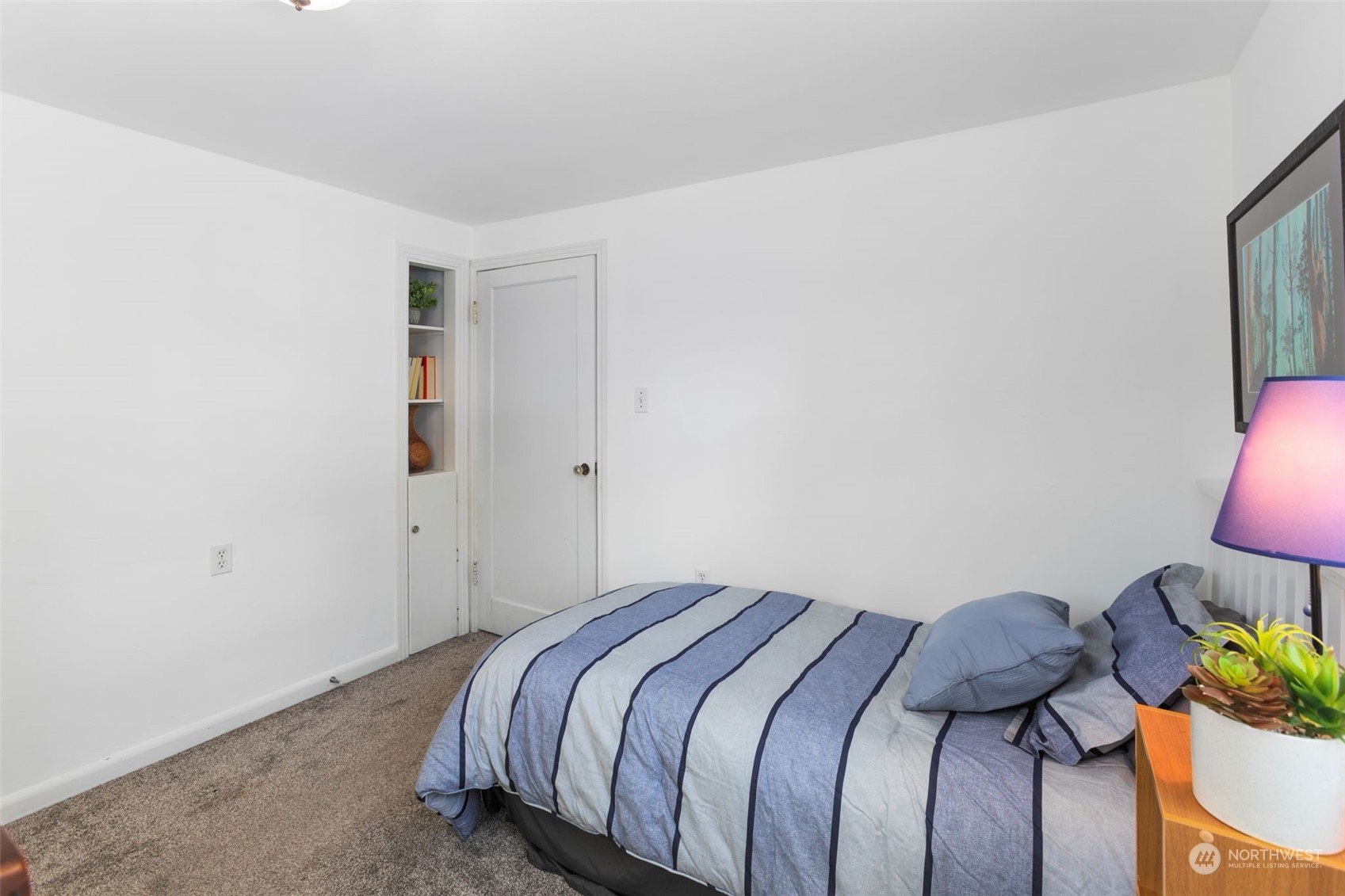 11616 6th Avenue Southwest Seattle, WA 98146 - Photo 15 of 37 a bedroom with a bed and a lamp on the dresser