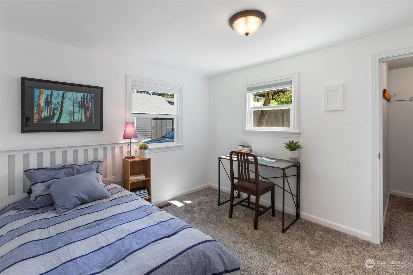 11616 6th Avenue Southwest Seattle, WA 98146 - Photo 16 of 37 a bedroom with a bed and a desk