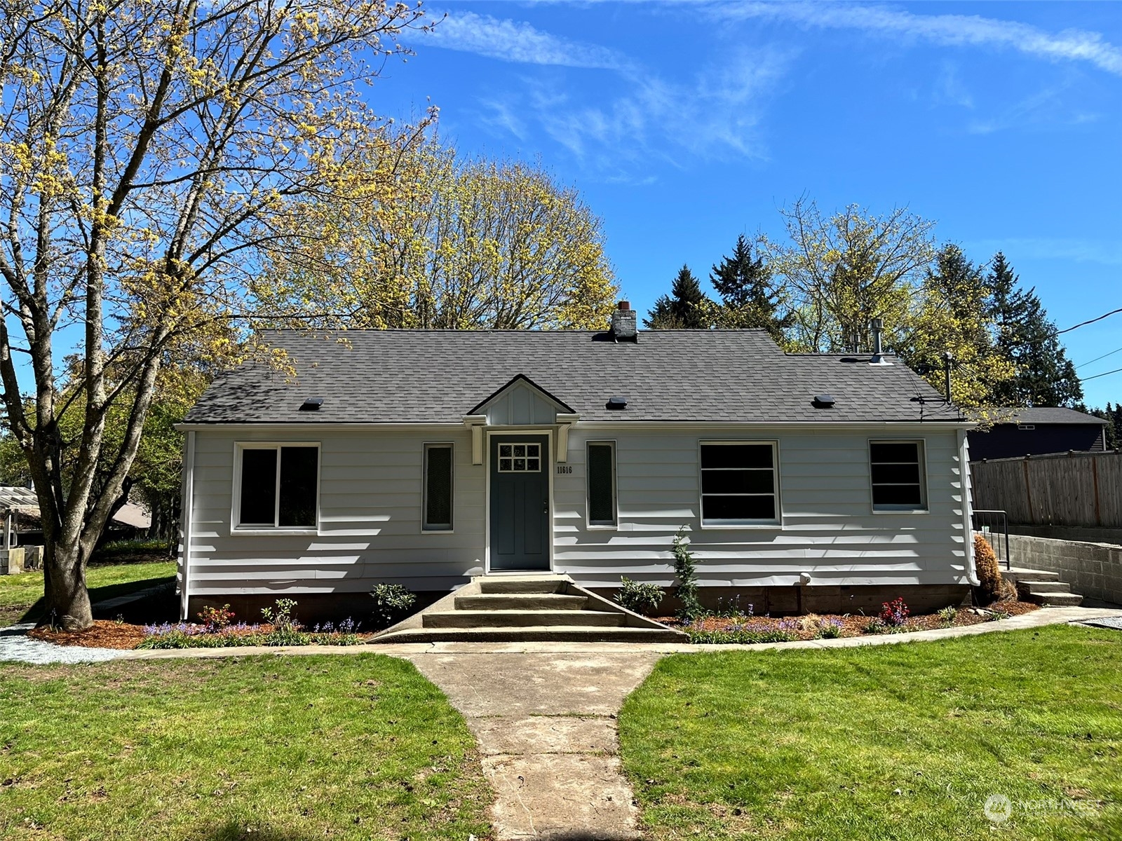 11616 6th Avenue Southwest Seattle, WA 98146 - Photo 2 of 37 a front view of a house with a yard