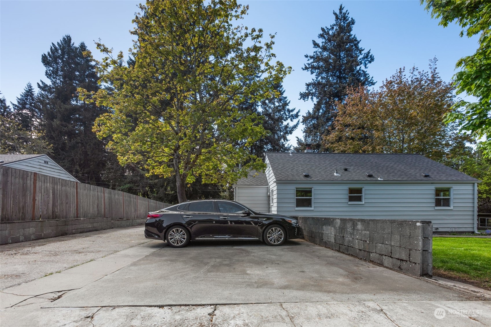 11616 6th Avenue Southwest Seattle, WA 98146 - Photo 23 of 37 a view of a car that is parked in front of house