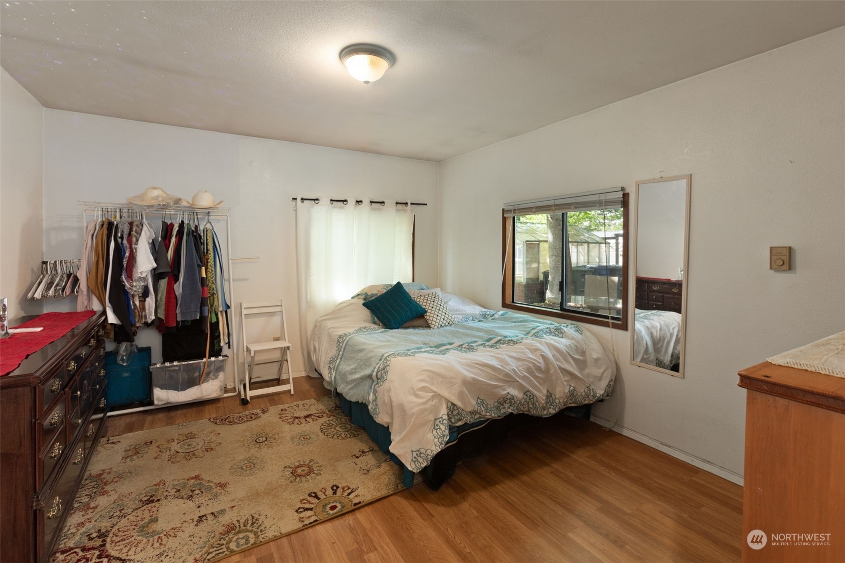 11616 6th Avenue Southwest Seattle, WA 98146 - Photo 30 of 37 a bedroom with a bed and a large window