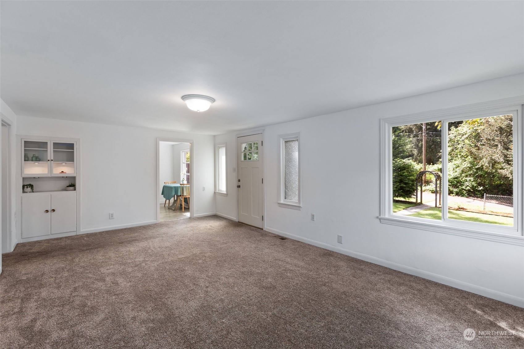 11616 6th Avenue Southwest Seattle, WA 98146 - Photo 7 of 37 an empty room with windows