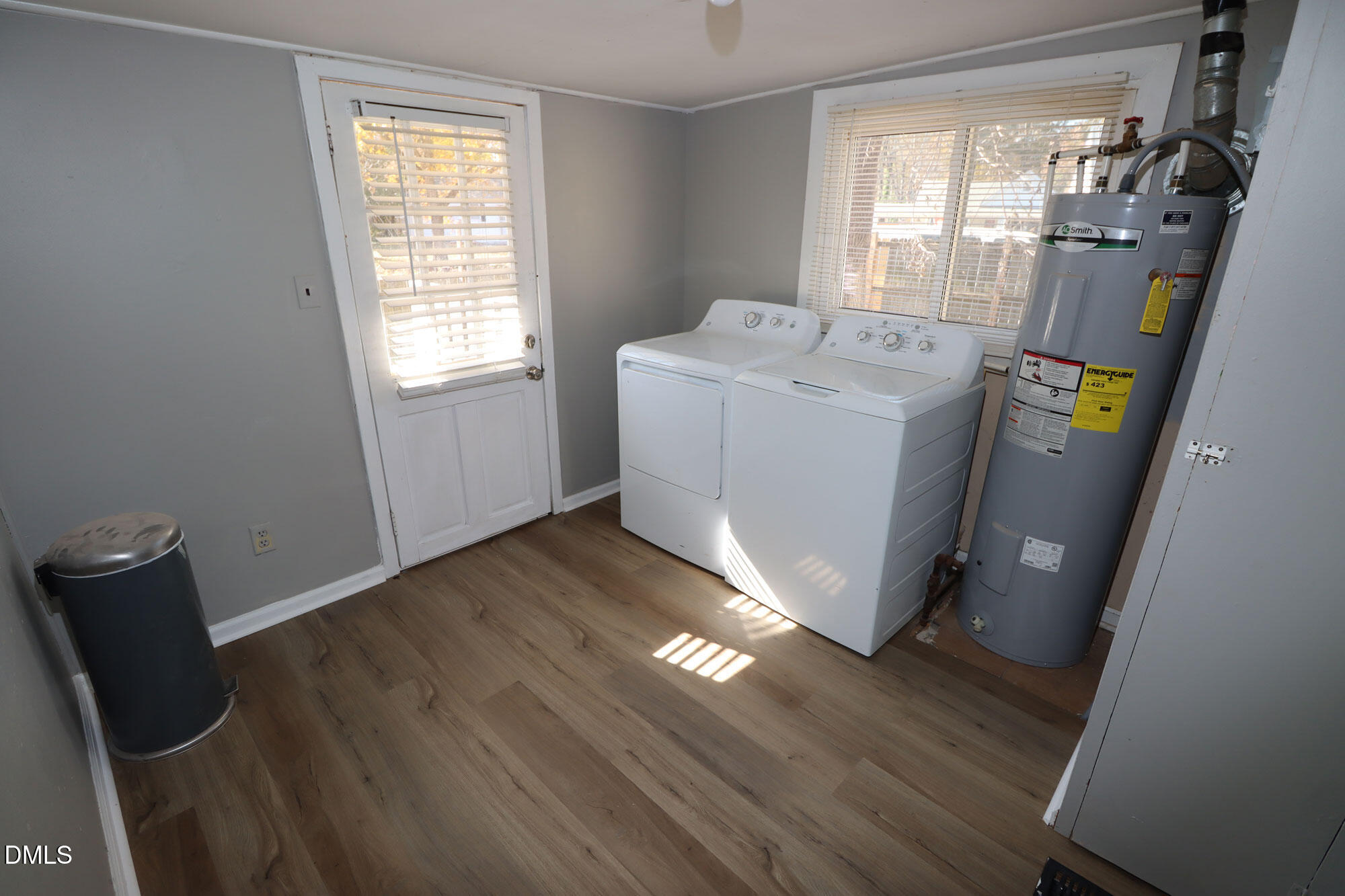 110 Emory Street Garner, NC 27529 - Photo 15 of 22 a utility room with wooden floor washer and dryer