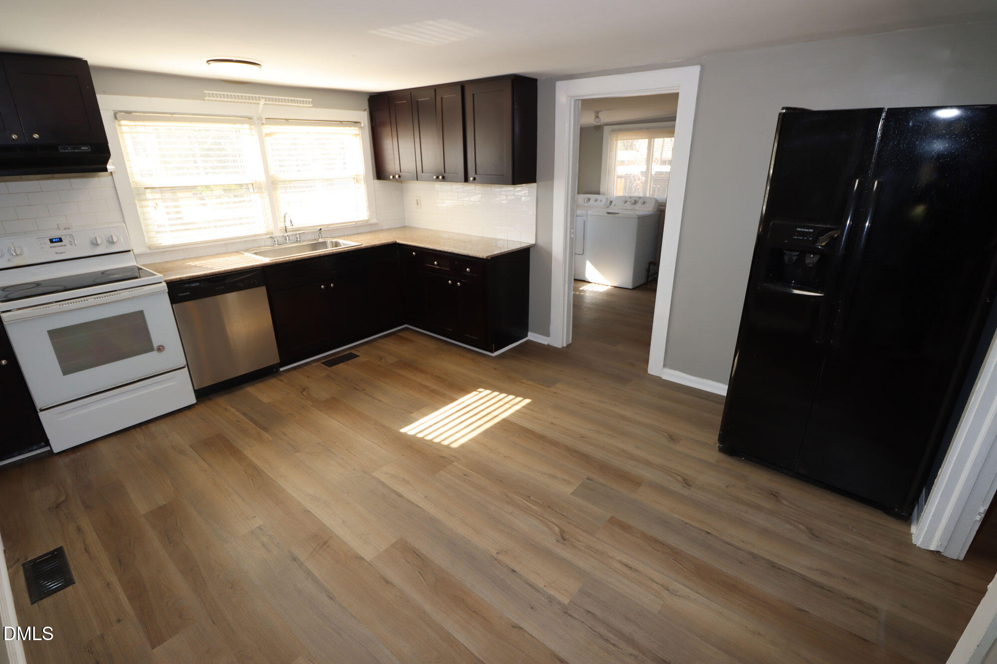 110 Emory Street Garner, NC 27529 - Photo 3 of 22 a kitchen with granite countertop a refrigerator and a stove
