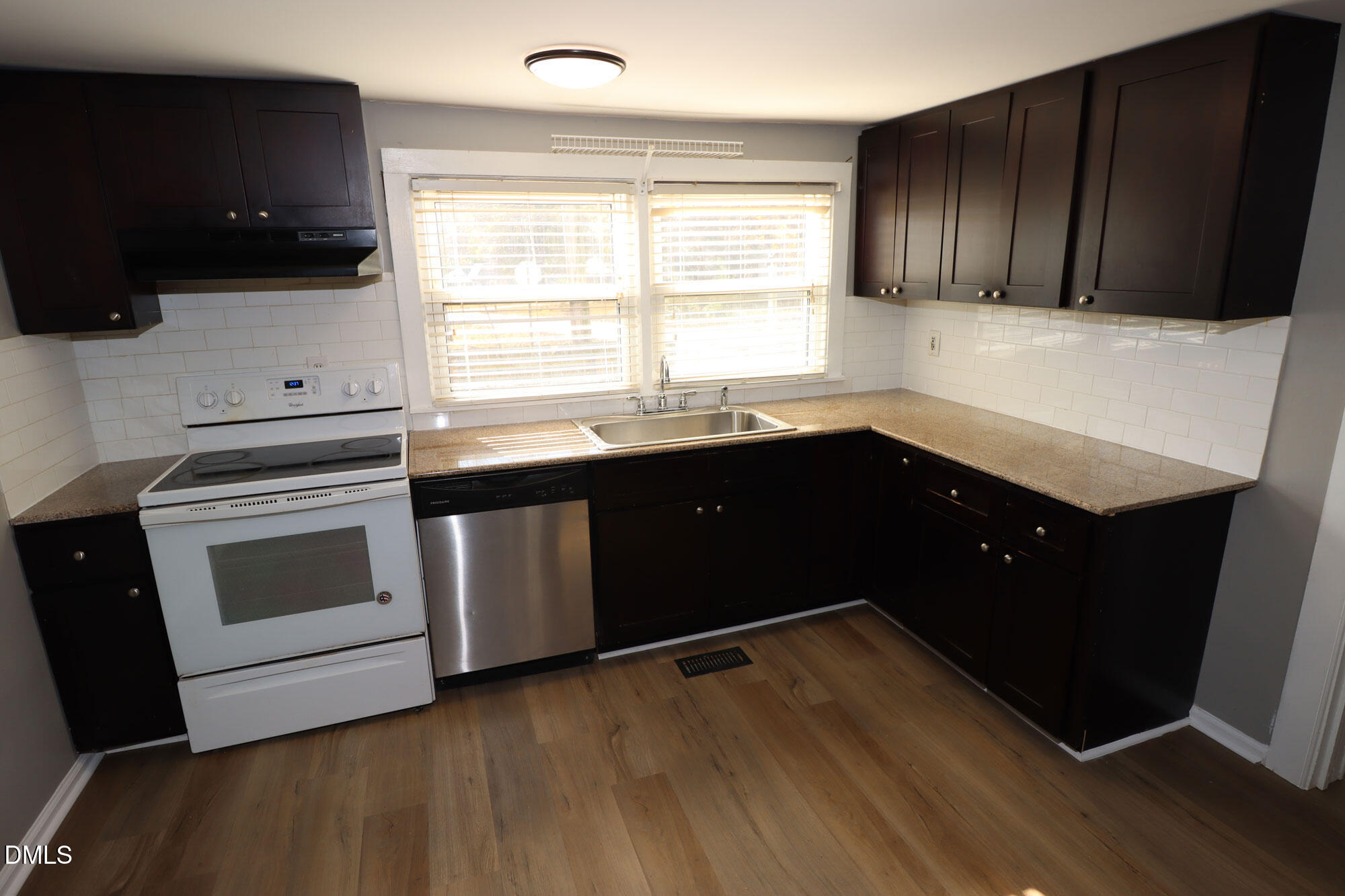 110 Emory Street Garner, NC 27529 - Photo 4 of 22 a kitchen with a sink and a stove top oven