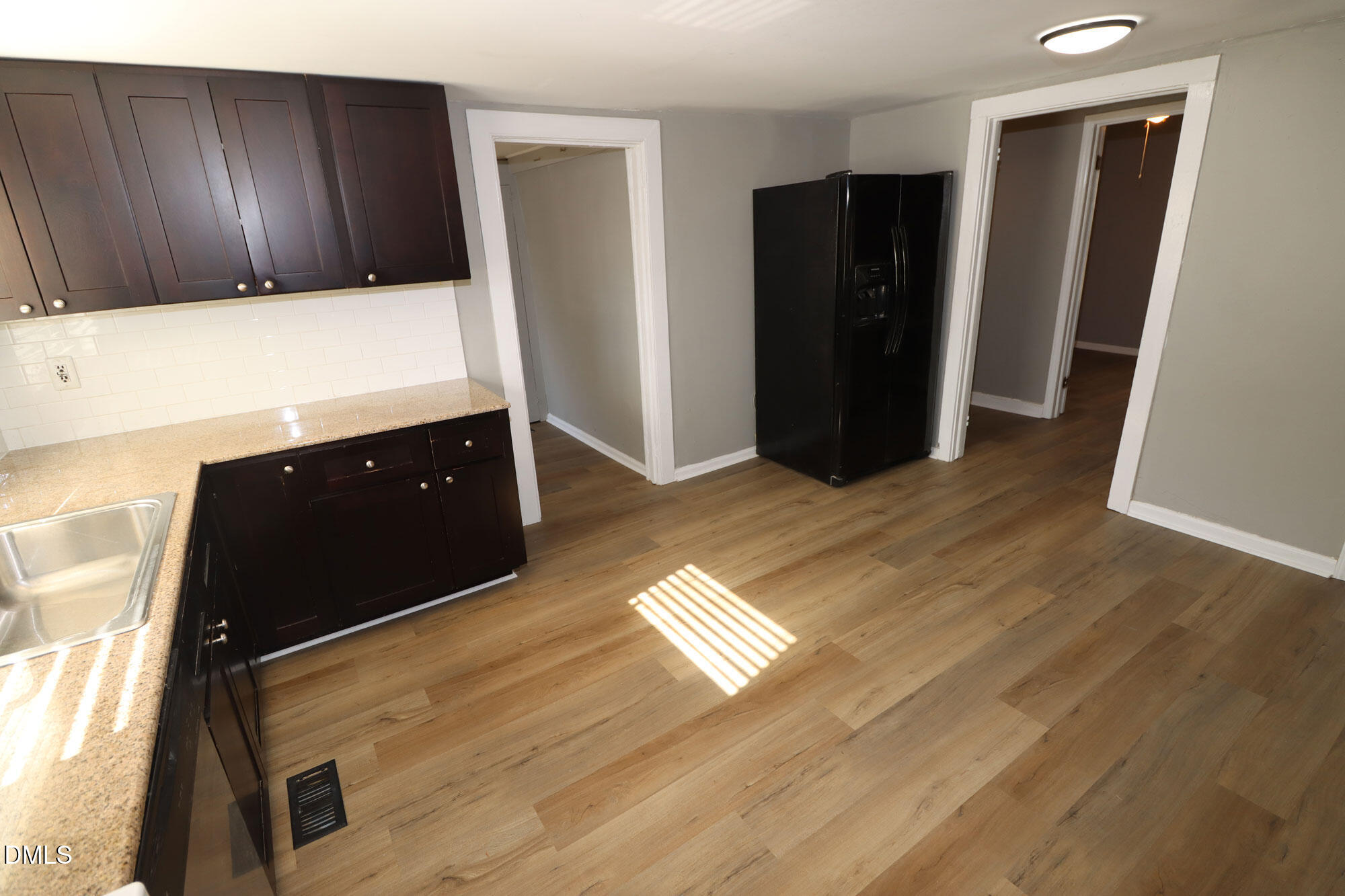 110 Emory Street Garner, NC 27529 - Photo 5 of 22 a view of kitchen with refrigerator and window