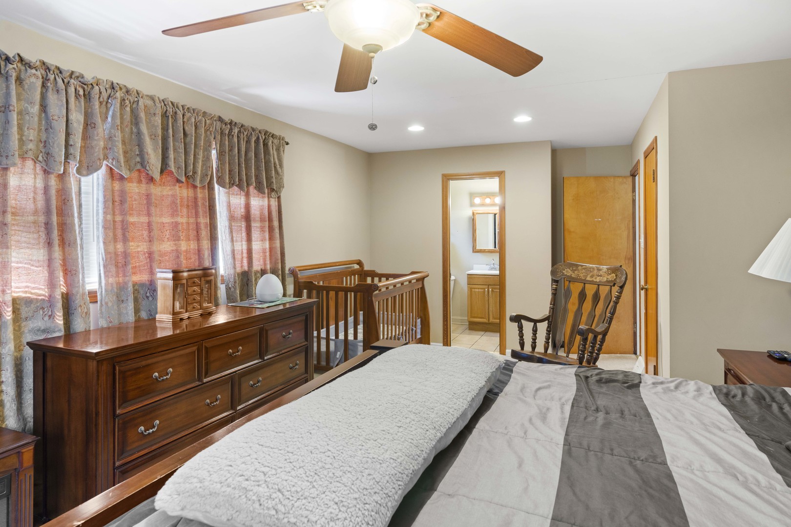 18335 Riegel Road Homewood, IL 60430 - Photo 17 of 23 a spacious bedroom with a bed and a large window