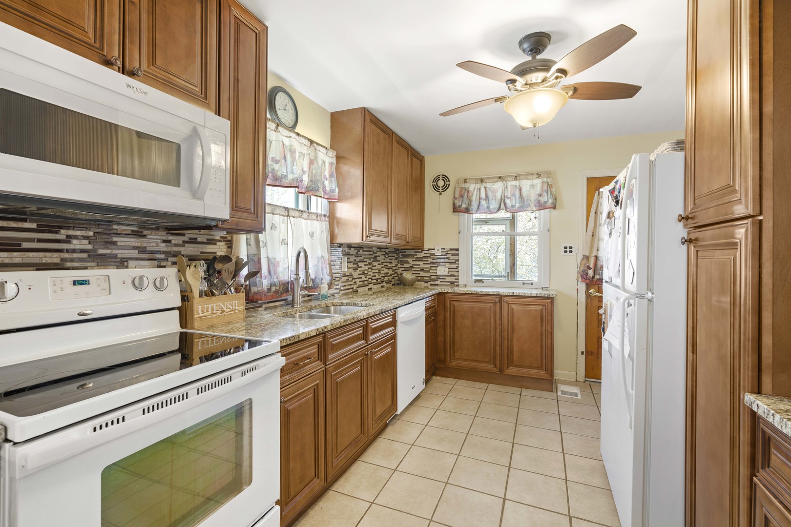 18335 Riegel Road Homewood, IL 60430 - Photo 8 of 23 a kitchen with a stove a sink and a refrigerator