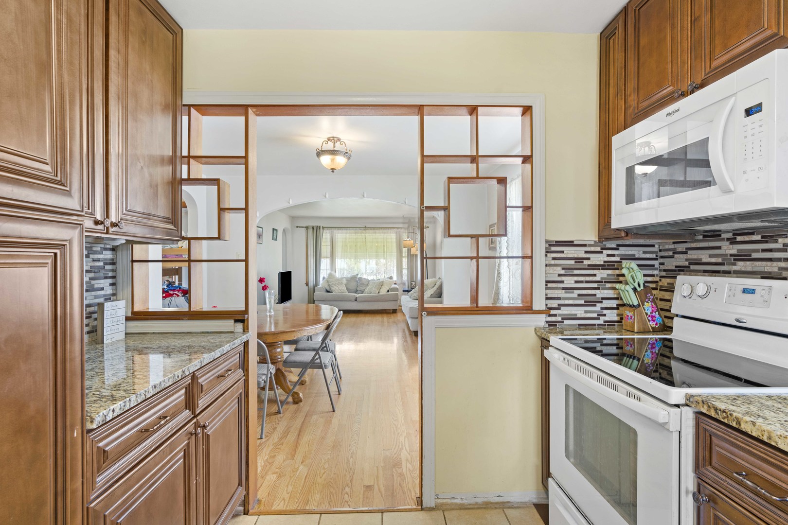 18335 Riegel Road Homewood, IL 60430 - Photo 9 of 23 a kitchen with stainless steel appliances granite countertop a stove and a refrigerator