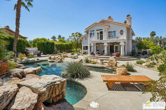 a view of a house with sitting area and furniture