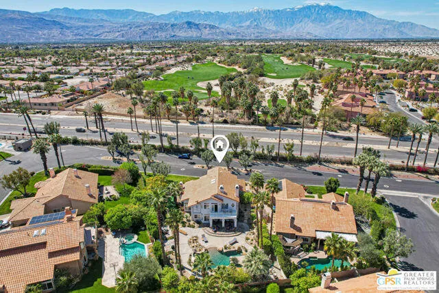 a view of a patio with table and chairs with wooden fence and plants