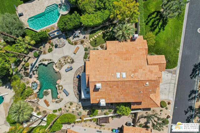 a view of a building with sitting area and furniture
