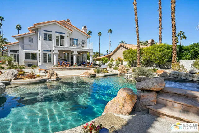 a front view of a house with sitting area