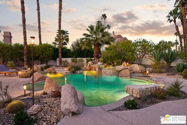 a view of a livingroom with workspace and a window
