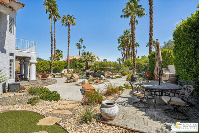 364 Oakmont Drive Palm Desert, CA 92211 - Photo 20 of 74 a view of a patio with plants and chairs