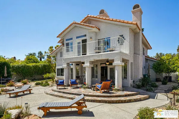 a living room with furniture fireplace and window