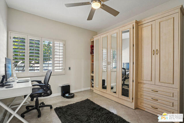 364 Oakmont Drive Palm Desert, CA 92211 - Photo 34 of 74 a view of a livingroom with workspace and a window