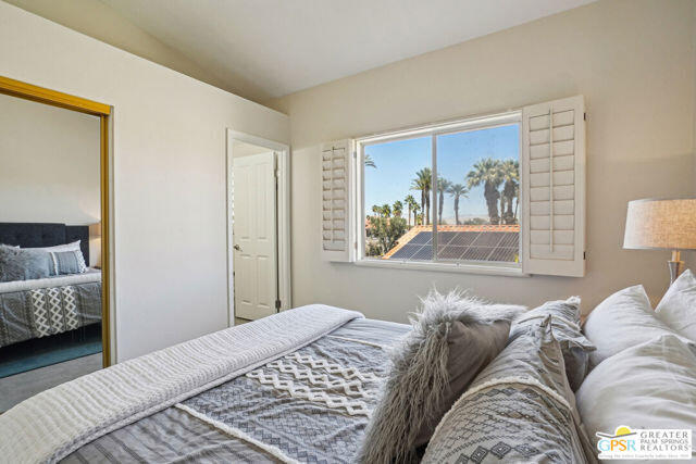 364 Oakmont Drive Palm Desert, CA 92211 - Photo 36 of 74 a bedroom with a bed and a couch