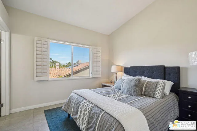 a bed room with bed and window